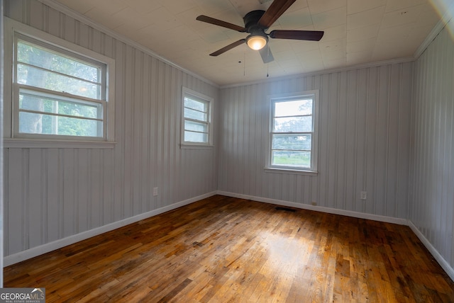 290 Mcree Dr, Camilla, GA 31730 - empty room with wood-type flooring, ornamental molding, and a ceiling fan