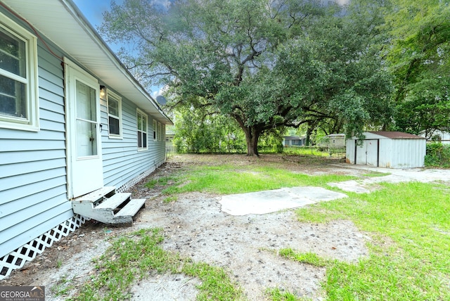 290 Mcree Dr, Camilla, GA 31730 - view of green lawn with a storage shed