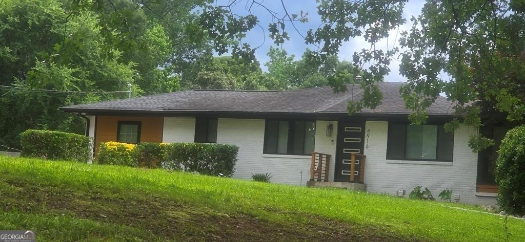 4916 Campbellton Rd SW, South Fulton, GA 30331 - view of front of home featuring brick siding, roof with shingles, and a front lawn