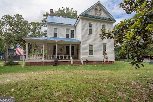 202 E Oak St, Luthersville, GA 30251 - back of house with a porch, a chimney, a yard, and a metal roof