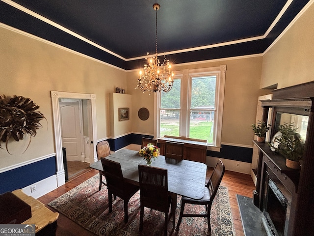 202 E Oak St, Luthersville, GA 30251 - dining room with ornamental molding, wood finished floors, and a chandelier