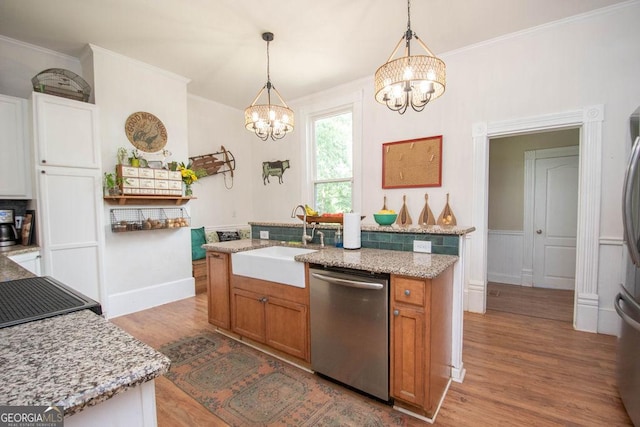 202 E Oak St, Luthersville, GA 30251 - kitchen with stainless steel dishwasher, a chandelier, light wood-style flooring, a center island with sink, and ornamental molding