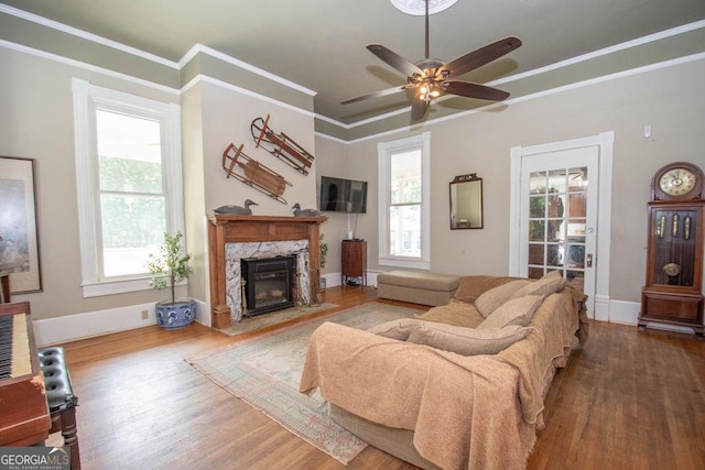 202 E Oak St, Luthersville, GA 30251 - living area with wood finished floors, ceiling fan, a premium fireplace, and ornamental molding