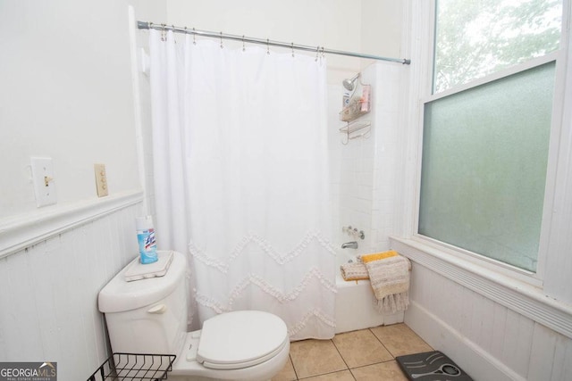 202 E Oak St, Luthersville, GA 30251 - bathroom with tile patterned flooring, a wainscoted wall, and shower / tub combo