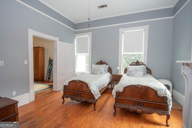 202 E Oak St, Luthersville, GA 30251 - bedroom featuring wood finished floors and ornamental molding