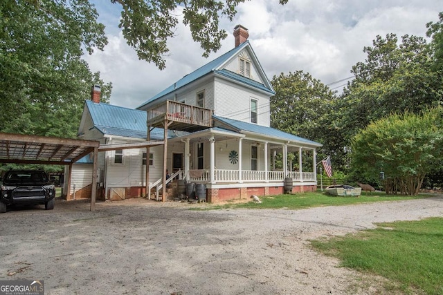 202 E Oak St, Luthersville, GA 30251 - view of front of property featuring a porch, a chimney, driveway, and a metal roof