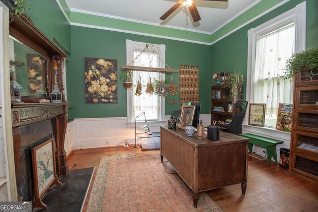 202 E Oak St, Luthersville, GA 30251 - home office featuring hardwood / wood-style flooring, a wainscoted wall, a ceiling fan, a premium fireplace, and crown molding