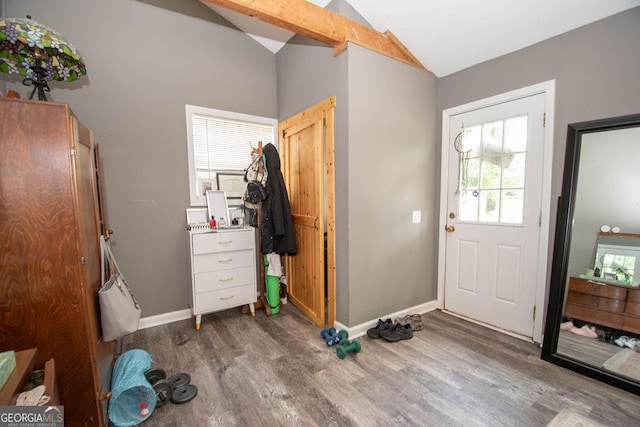 202 E Oak St, Luthersville, GA 30251 - bedroom with wood finished floors, lofted ceiling, and cooling unit