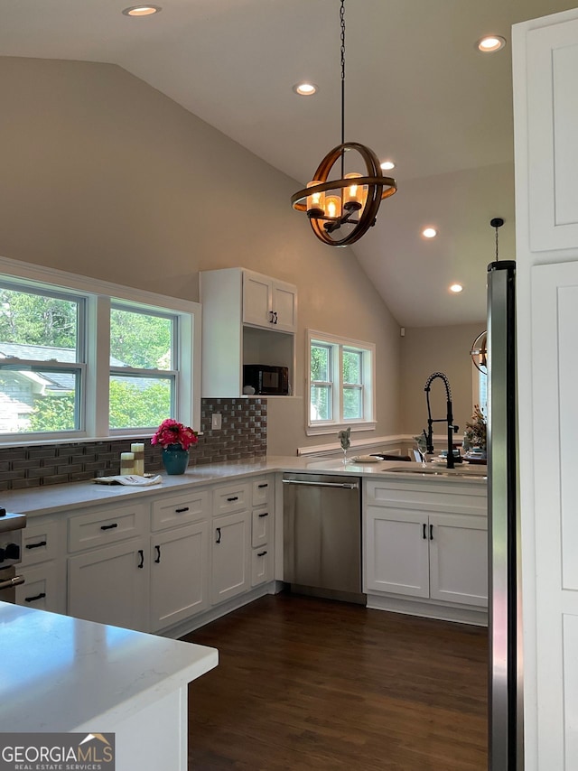 2170 Beecher Cir SW, Atlanta, GA 30311 - kitchen featuring dishwasher, vaulted ceiling, decorative backsplash, white cabinetry, and recessed lighting