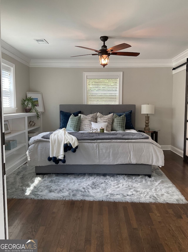2170 Beecher Cir SW, Atlanta, GA 30311 - bedroom featuring a barn door, multiple windows, ornamental molding, wood finished floors, and a ceiling fan