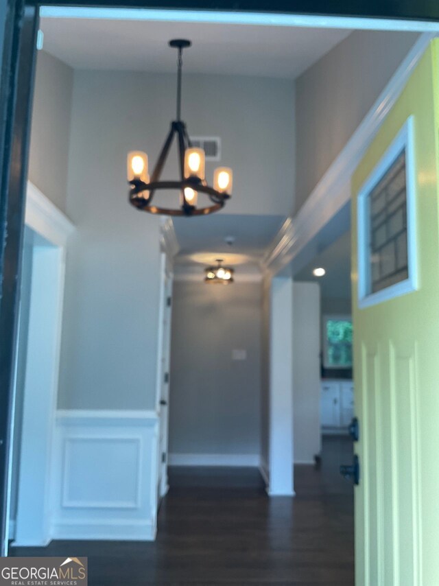 2170 Beecher Cir SW, Atlanta, GA 30311 - entryway with a chandelier, dark wood finished floors, and a wainscoted wall