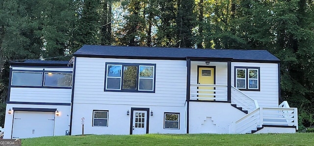 2170 Beecher Cir SW, Atlanta, GA 30311 - view of front of house with stairway, an attached garage, and a front lawn