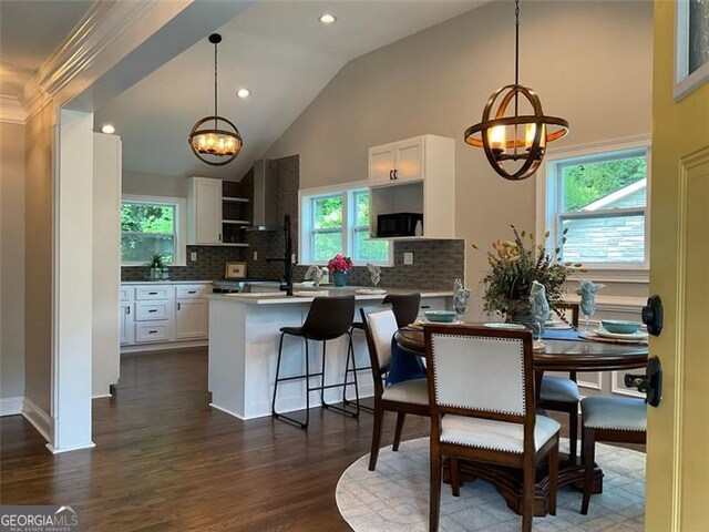 2170 Beecher Cir SW, Atlanta, GA 30311 - dining space featuring a chandelier, dark wood finished floors, healthy amount of natural light, high vaulted ceiling, and recessed lighting