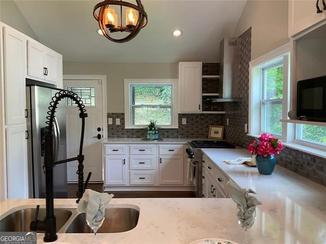 2170 Beecher Cir SW, Atlanta, GA 30311 - kitchen featuring vaulted ceiling, stainless steel appliances, decorative backsplash, white cabinetry, and recessed lighting
