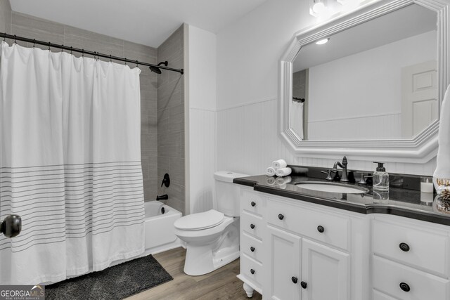 322 Pea Ridge Rd, Franklin, GA 30217 - full bath featuring vanity, wood finished floors, shower / tub combo with curtain, and a wainscoted wall