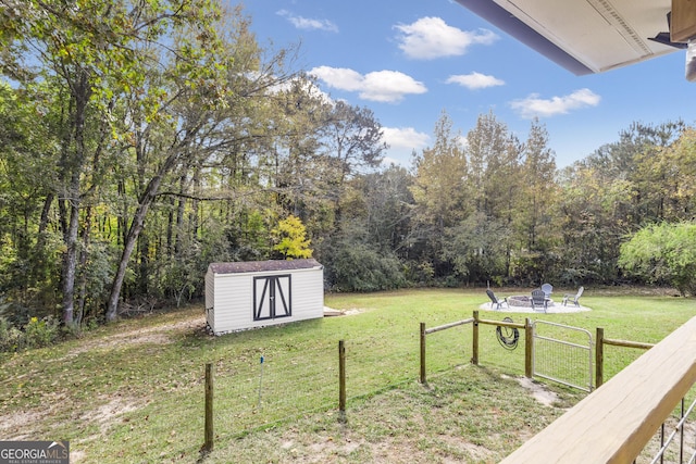 322 Pea Ridge Rd, Franklin, GA 30217 - view of yard featuring a shed and an outdoor fire pit