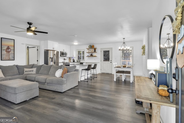 322 Pea Ridge Rd, Franklin, GA 30217 - living area with a chandelier, dark wood-style flooring, and a ceiling fan