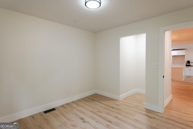 206 2nd St, Gainesville, GA 30504 - spare room featuring light wood-style flooring and baseboards