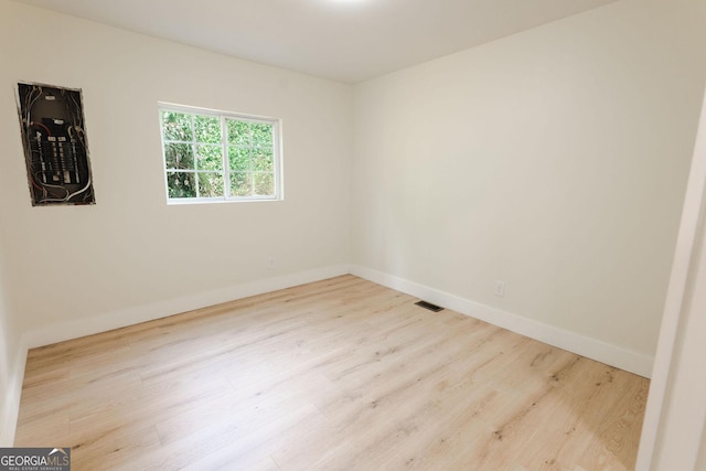 206 2nd St, Gainesville, GA 30504 - empty room with wood finished floors and baseboards