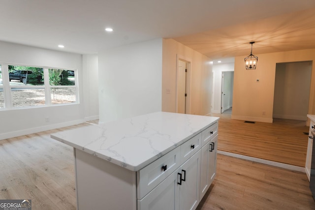 206 2nd St, Gainesville, GA 30504 - kitchen with light wood-style flooring, white cabinets, recessed lighting, pendant lighting, and a center island