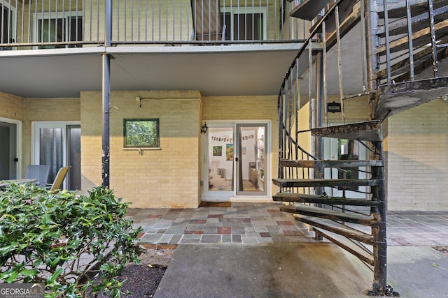 5400 Roswell Rd Apt L 6, Sandy Springs, GA 30342 - entrance to property featuring brick siding and a balcony