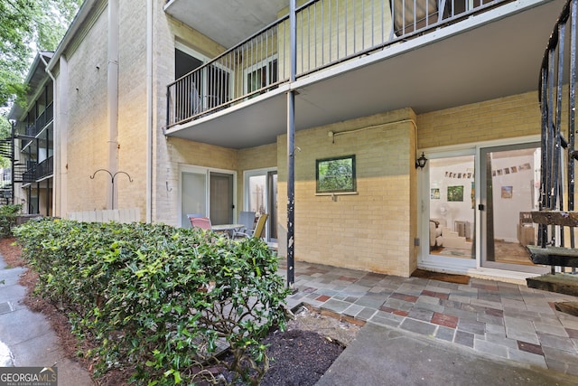 5400 Roswell Rd Apt L 6, Sandy Springs, GA 30342 - view of exterior entry featuring brick siding