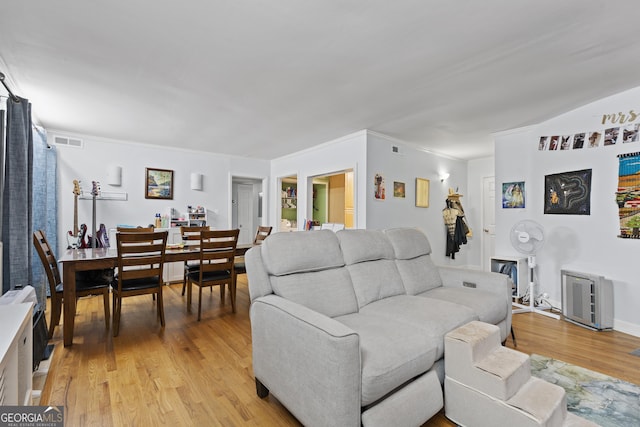 5400 Roswell Rd Apt L 6, Sandy Springs, GA 30342 - living room featuring light wood-style flooring and crown molding