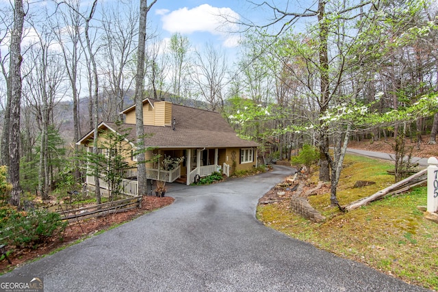 705 Laurel Ridge Dr, Ellijay, GA 30536 - rustic home featuring a porch, a shingled roof, and driveway