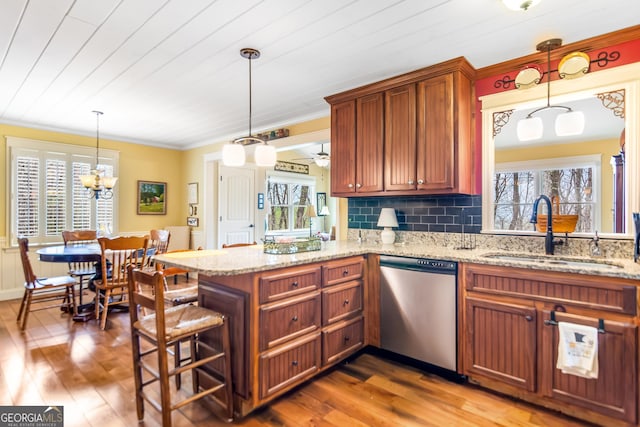 705 Laurel Ridge Dr, Ellijay, GA 30536 - kitchen featuring dishwasher, ornamental molding, hardwood / wood-style flooring, a peninsula, and tasteful backsplash