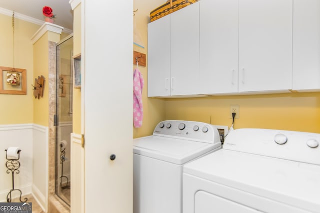 705 Laurel Ridge Dr, Ellijay, GA 30536 - washroom featuring washer and clothes dryer, ornamental molding, and cabinet space