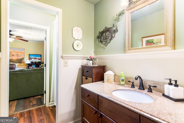 705 Laurel Ridge Dr, Ellijay, GA 30536 - bathroom with wood finished floors, wainscoting, vanity, and ceiling fan