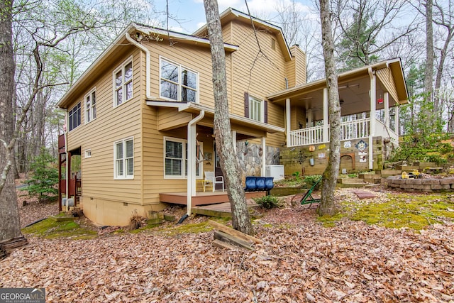 705 Laurel Ridge Dr, Ellijay, GA 30536 - back of property with a chimney and a ceiling fan