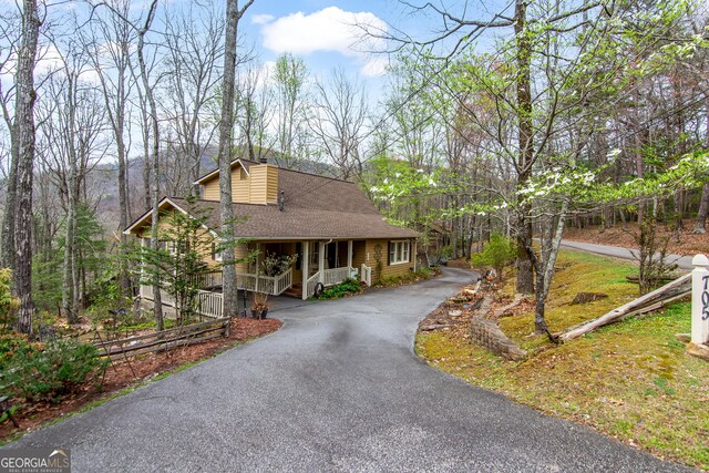 705 Laurel Ridge Dr, Ellijay, GA 30536 - rustic home featuring a porch, a shingled roof, and driveway