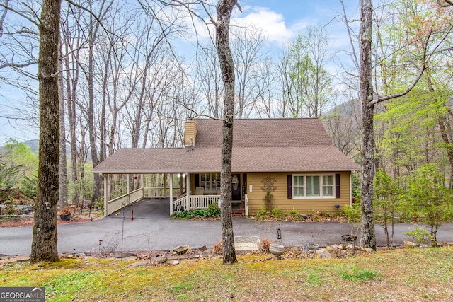 705 Laurel Ridge Dr, Ellijay, GA 30536 - chalet / cabin with a porch, a carport, asphalt driveway, and a shingled roof