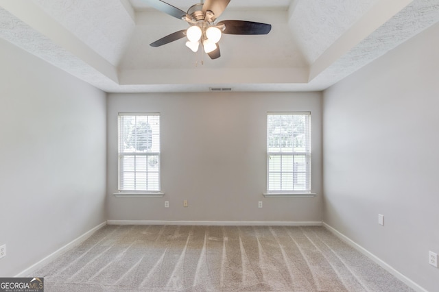 926 Masters Dr, Monroe, GA 30655 - carpeted empty room featuring a tray ceiling and a ceiling fan