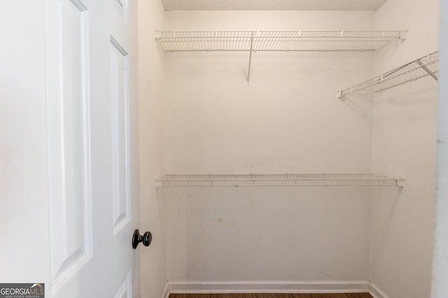 926 Masters Dr, Monroe, GA 30655 - walk in closet featuring wood finished floors