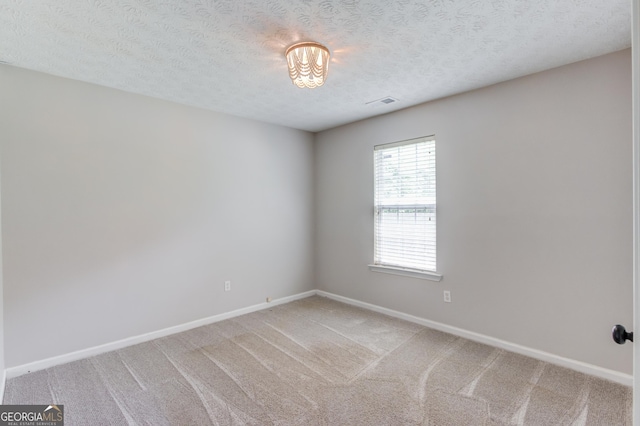 926 Masters Dr, Monroe, GA 30655 - spare room featuring light colored carpet and a textured ceiling