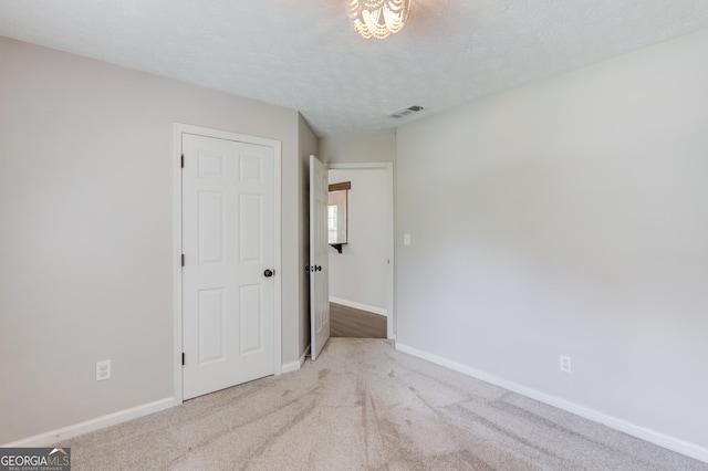 926 Masters Dr, Monroe, GA 30655 - empty room featuring carpet floors and a textured ceiling