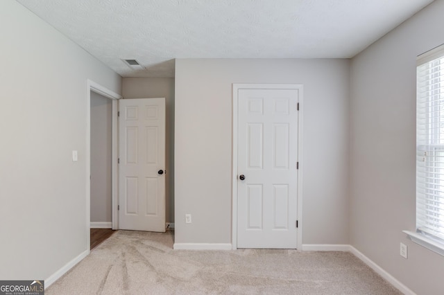 926 Masters Dr, Monroe, GA 30655 - unfurnished bedroom with carpet flooring and multiple windows