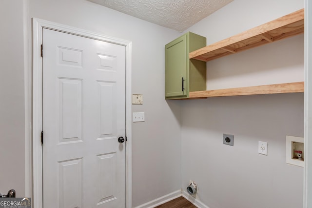 926 Masters Dr, Monroe, GA 30655 - laundry area featuring hookup for an electric dryer, hookup for a washing machine, cabinet space, and dark wood-style flooring