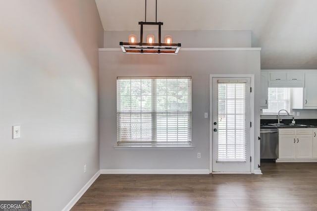 926 Masters Dr, Monroe, GA 30655 - unfurnished dining area with a chandelier, dark wood-style flooring, and vaulted ceiling