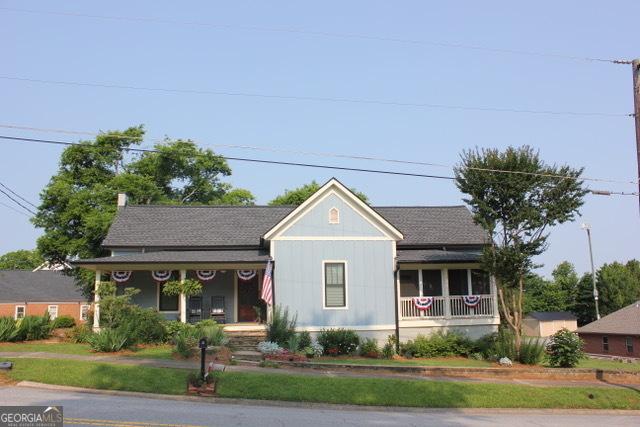5880 Mulberry St, Austell, GA 30168 - view of front facade featuring covered porch