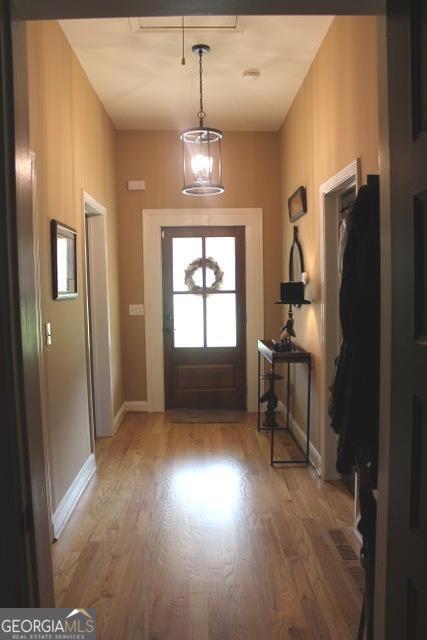 5880 Mulberry St, Austell, GA 30168 - entryway with light wood-style flooring and baseboards