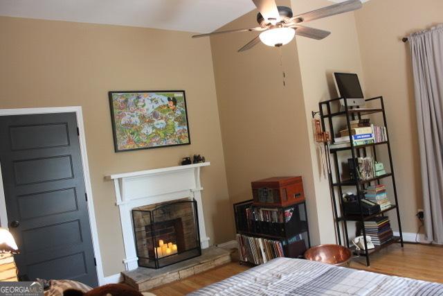 5880 Mulberry St, Austell, GA 30168 - bedroom with wood finished floors and a fireplace