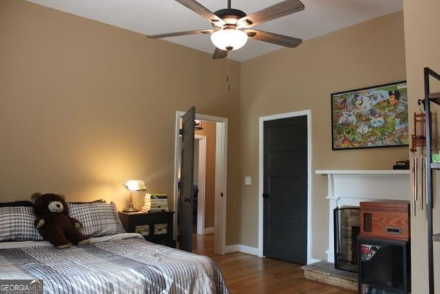 5880 Mulberry St, Austell, GA 30168 - bedroom with wood finished floors and a ceiling fan