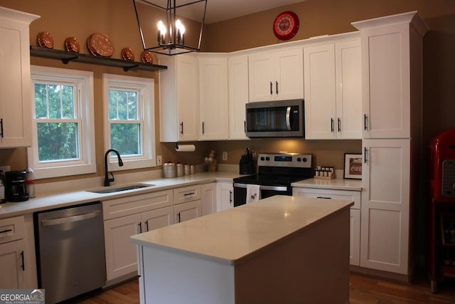 5880 Mulberry St, Austell, GA 30168 - kitchen featuring appliances with stainless steel finishes, light countertops, and white cabinetry