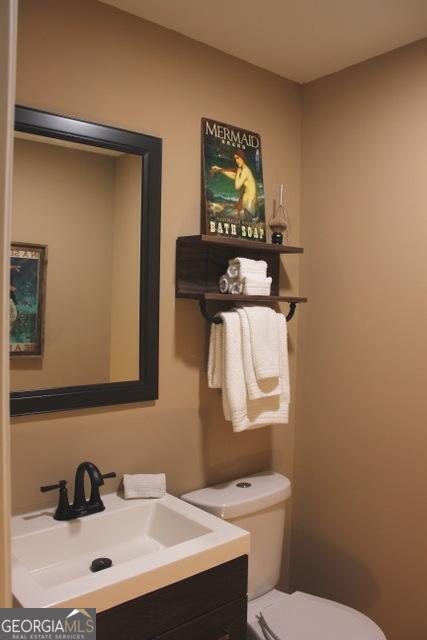 5880 Mulberry St, Austell, GA 30168 - half bathroom featuring vanity and toilet