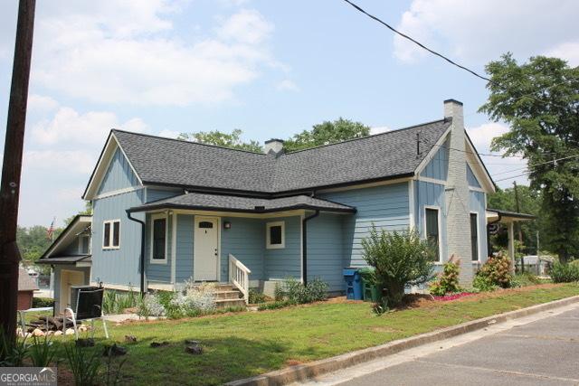 5880 Mulberry St, Austell, GA 30168 - view of front of house with a chimney and a front lawn