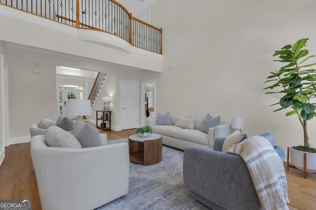 140 Olivia Ct, Fayetteville, GA 30215 - living area with stairs, a high ceiling, and wood finished floors