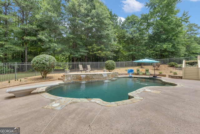 140 Olivia Ct, Fayetteville, GA 30215 - view of pool with a patio area, a fenced backyard, a diving board, and view of scattered trees